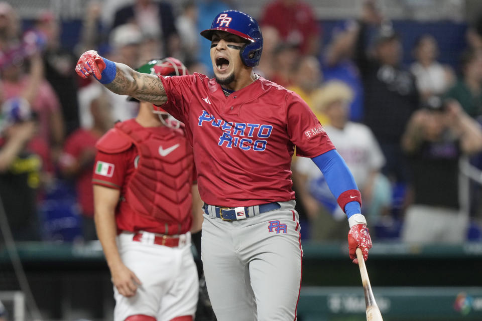 Puerto Rico's Javier Baez (9) gestures after hitting a home run during the first inning of a World Baseball Classic game against Mexico, Friday, March 17, 2023, in Miami. (AP Photo/Marta Lavandier)