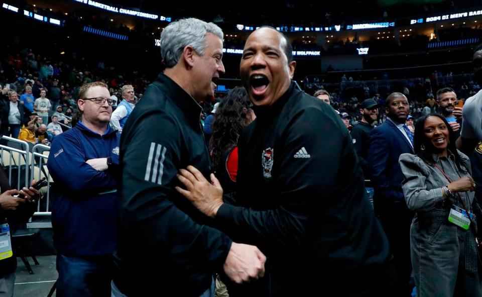 N.C. State head coach Kevin Keatts celebrates with athletic director Boo Corrigan following the Wolfpack’s 79-73 overtime win against Oakland in the second round of the NCAA Tournament on Saturday, March 23, 2024, at PPG Paints Arena in Pittsburgh, Pa. Kaitlin McKeown/kmckeown@newsobserver.com