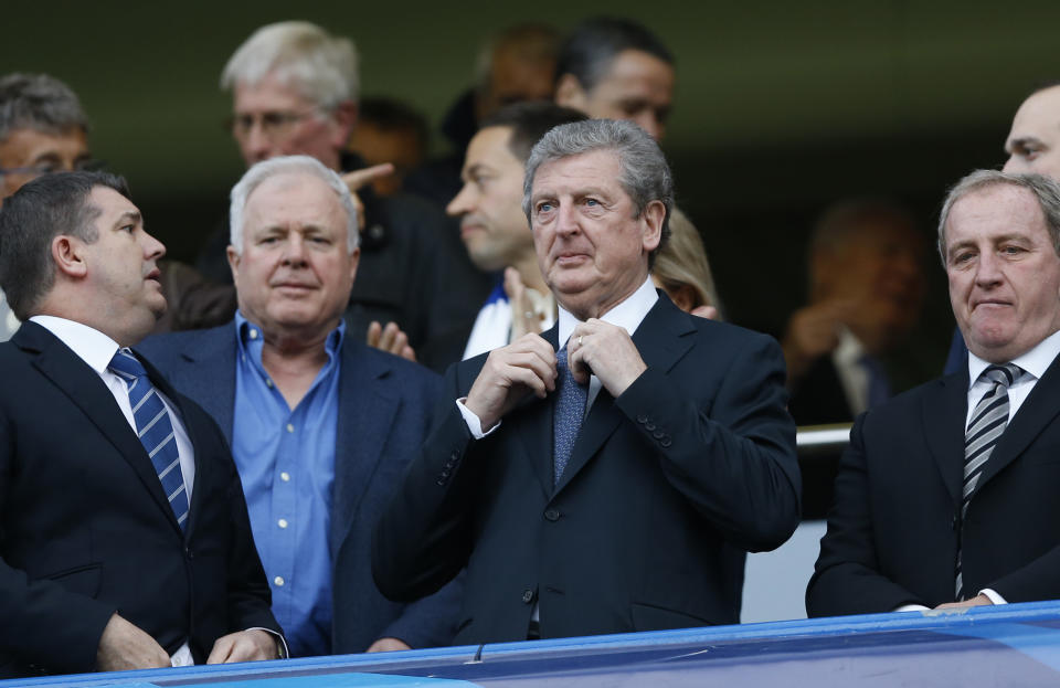England's national team manager Roy Hodgson, centre waits for the start of a Champions League semifinal second leg soccer match between Chelsea and Atletico Madrid at Stamford Bridge Stadium in London Wednesday, April 30, 2014. (AP Photo/Kirsty Wigglesworth)