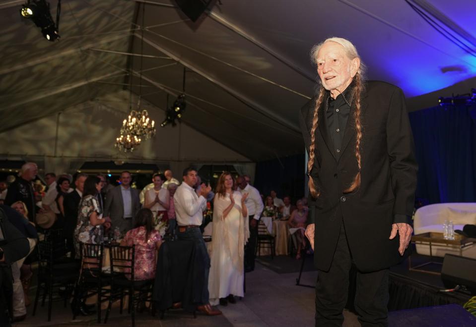 Willie Nelson receives the LBJ Liberty and Justice For All Award at a gala and musical tribute at the LBJ Presidential Library on May 12. The proceeds from the gala will benefit the newly established Willie Nelson Endowment for Uplifting Rural Communities.