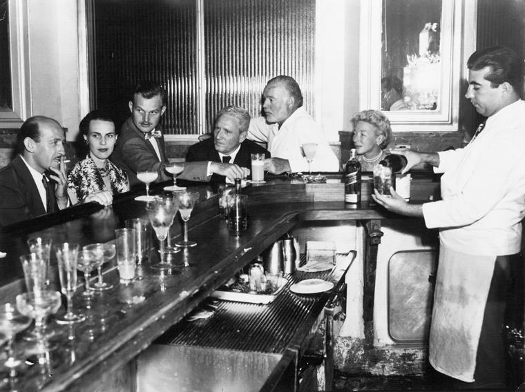 Ernest and Mary Hemingway with Spencer Tracy at the bar corner in El Floridita, Havana, Cuba, ca. 1955.