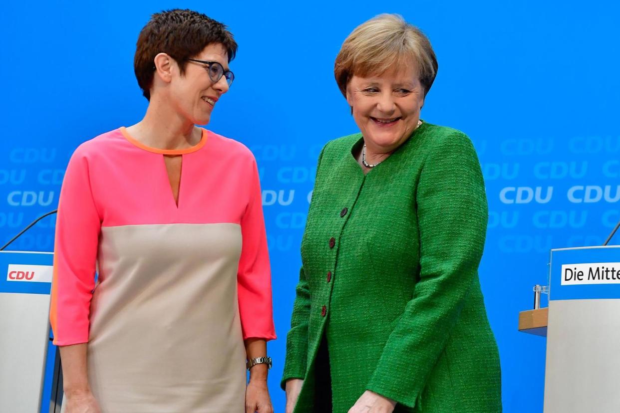 New ally: the newly appointed CDU general secretary Annegret Kramp-Karrenbauer with Chancellor Angela Merkel: AFP/Getty Images