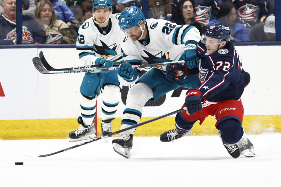 Columbus Blue Jackets forward Carson Meyer, right, collides with San Jose Sharks forward Ryan Carpenter (22) during the second period of an NHL hockey game in Columbus, Ohio, Saturday, March 16, 2024. (AP Photo/Paul Vernon)