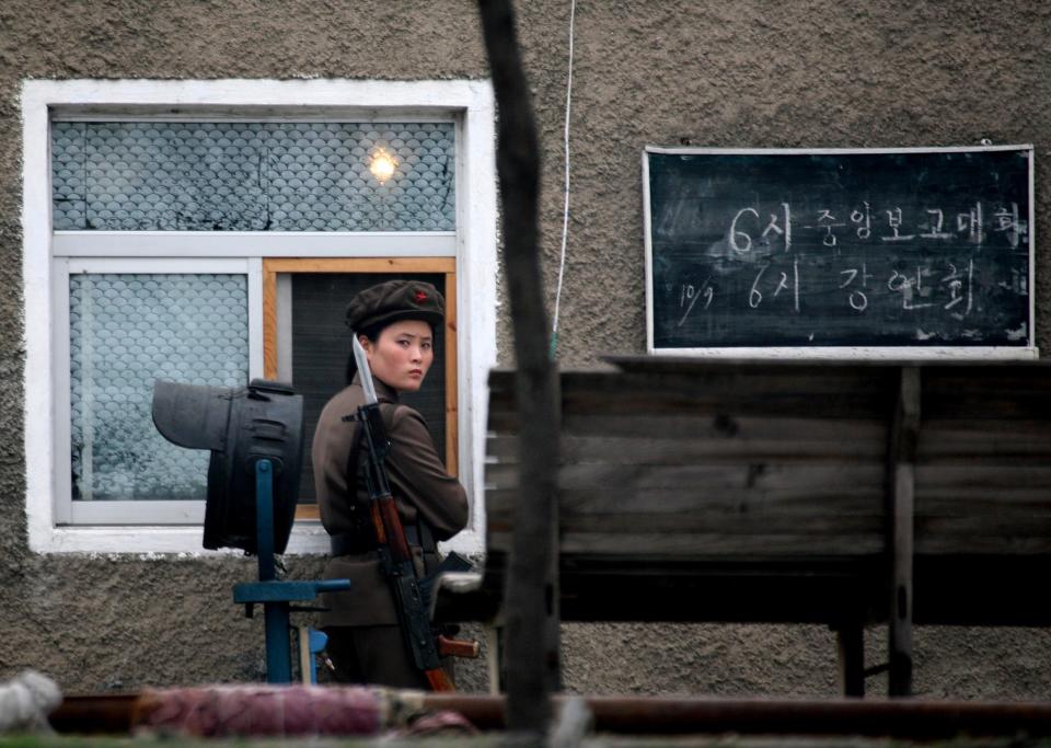 A North Korean soldier guards an army installation near the Chinese border.