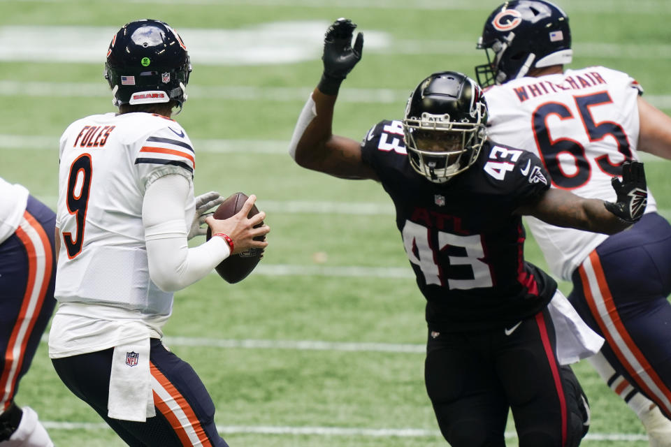 Chicago Bears quarterback Nick Foles (9) works against the Atlanta Falcons during the second half of an NFL football game, Sunday, Sept. 27, 2020, in Atlanta. (AP Photo/Brynn Anderson)