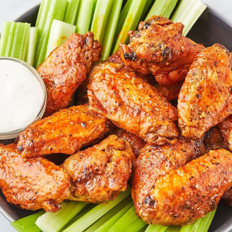 <p><a href="https://www.delish.com/uk/cooking/recipes/a30975501/fried-chicken-wings-recipe/" rel="nofollow noopener" target="_blank" data-ylk="slk:Fried Chicken Wings;elm:context_link;itc:0;sec:content-canvas" class="link ">Fried Chicken Wings</a> are delicious, but they make a big mess. These air fryer wings are super-easy, and they're just as crunchy as the oil-fried kind. We're hooked! Add buffalo sauce (or, really, any sauce you're a fan of) and you're good to go! </p><p>Get the <a href="https://www.delish.com/uk/cooking/recipes/a32262330/air-fryer-chicken-wings-recipe/" rel="nofollow noopener" target="_blank" data-ylk="slk:Air Fryer Chicken Wings;elm:context_link;itc:0;sec:content-canvas" class="link ">Air Fryer Chicken Wings</a> recipe.</p>