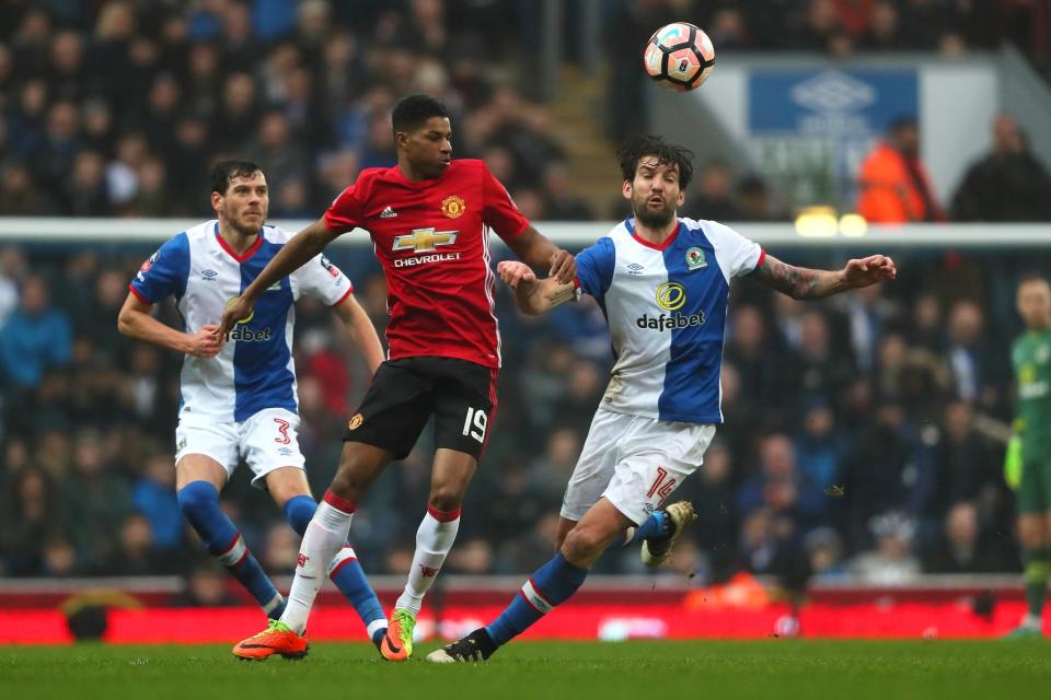 <p>Marcus Rashford challenges for the ball </p>