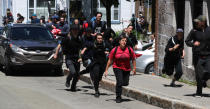 <p>Protesters run from riot police during the G7 Summit in Quebec City, Quebec, Canada, June 8, 2018. (Photo: Jonathan Ernst/Reuters) </p>