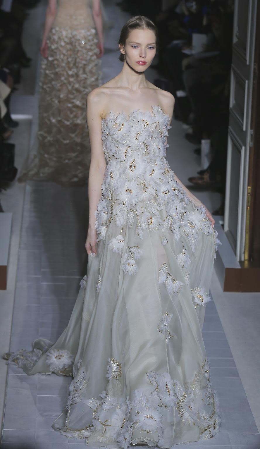 A model wears a creation by fashion designers Maria Grazia Chiuri and Pier Paolo Piccioli for Valentino as part of the Women's Spring/Summer 2013 Haute Couture fashion collection presented in Paris, Wednesday, Jan. 23 2013 (AP Photo/ Jacques Brinon)