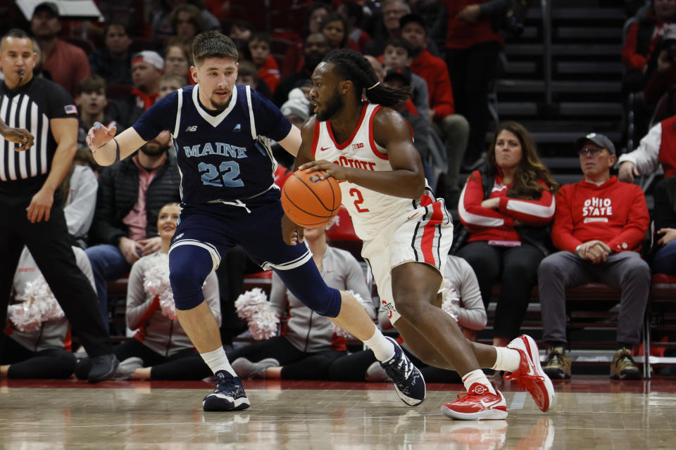 Ohio State's Bruce Thornton, right, drives to the basket as Maine's Gedi Juozapaitis defends during the first half of an NCAA college basketball game on Wednesday, Dec. 21, 2022, in Columbus, Ohio. (AP Photo/Jay LaPrete)