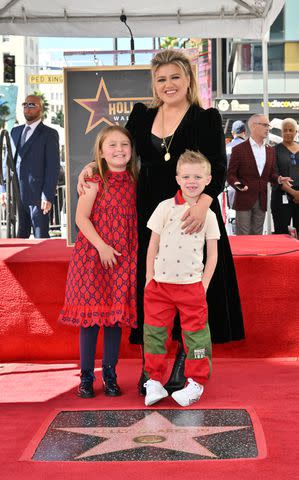 <p>Michael Buckner/Variety via Getty</p> Kelly Clarkson and children River Rose and Remington Alexander pose during the Star Ceremony for Kelly Clarkson on the Hollywood Walk of Fame in September 2022 in Los Angeles