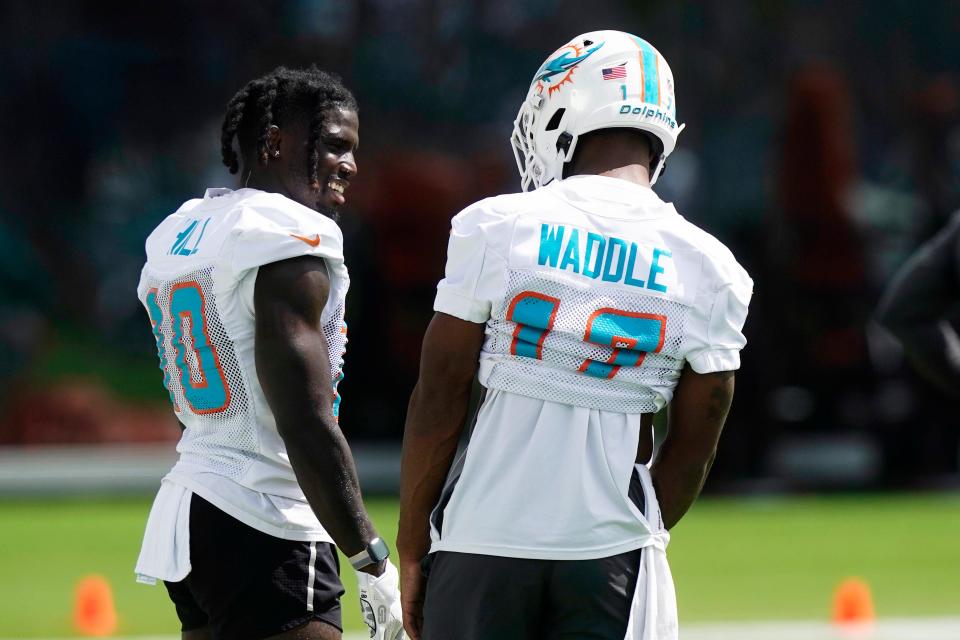 Dolphins receivers Tyreek Hill (left) and Jaylen Waddle during practice.