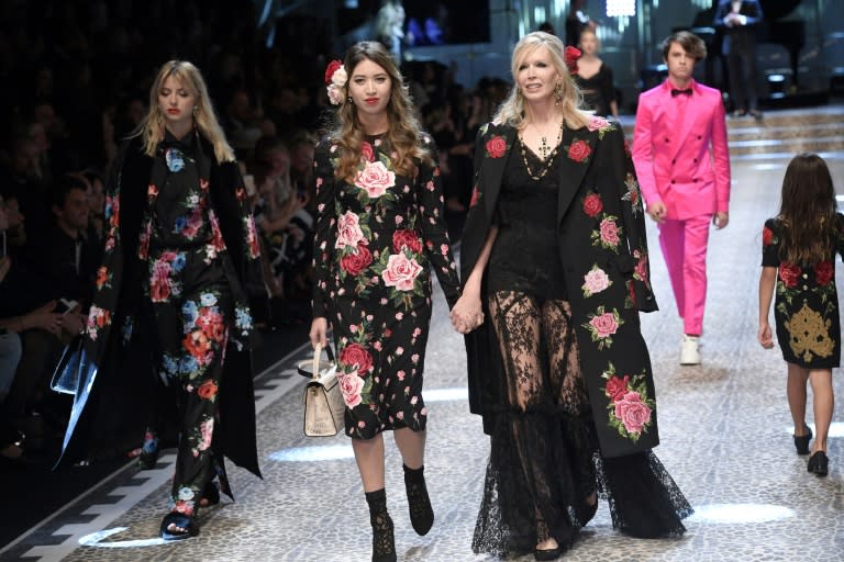 Models present creations for fashion house Dolce & Gabbana during the Women's Fall/Winter 2017/2018 fashion week in Milan, on February 26, 2017