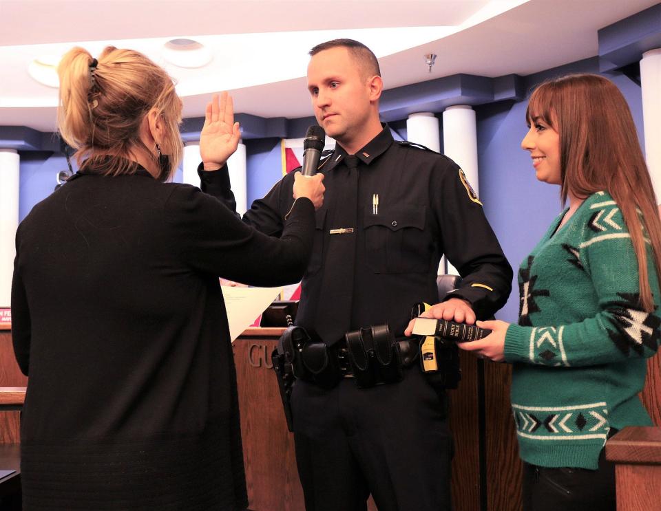 Venice Police Department Sgt. Louis White is promoted to Police Lieutenant and sworn in during Tuesday's City Council meeting by City Clerk Kelly Michaels, with his wife Alicia at his side.
