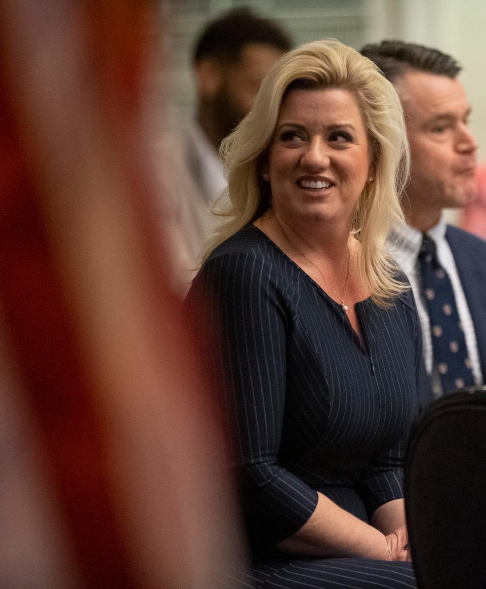 Indiana Secretary of State Holli Sullivan listens to a speech during the Vanderburgh County Lincoln Day Dinner at the Evansville Country Club in Evansville, Ind., Thursday night, Feb. 24, 2022. 