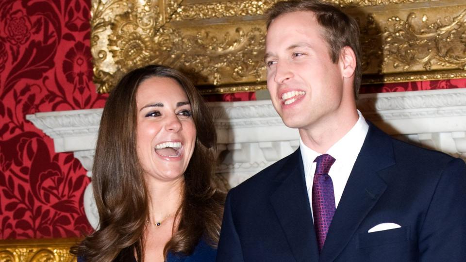 Prince William and Kate Middleton laughing as they pose for engagement photographs in St James's Palace on 16 November 2010 