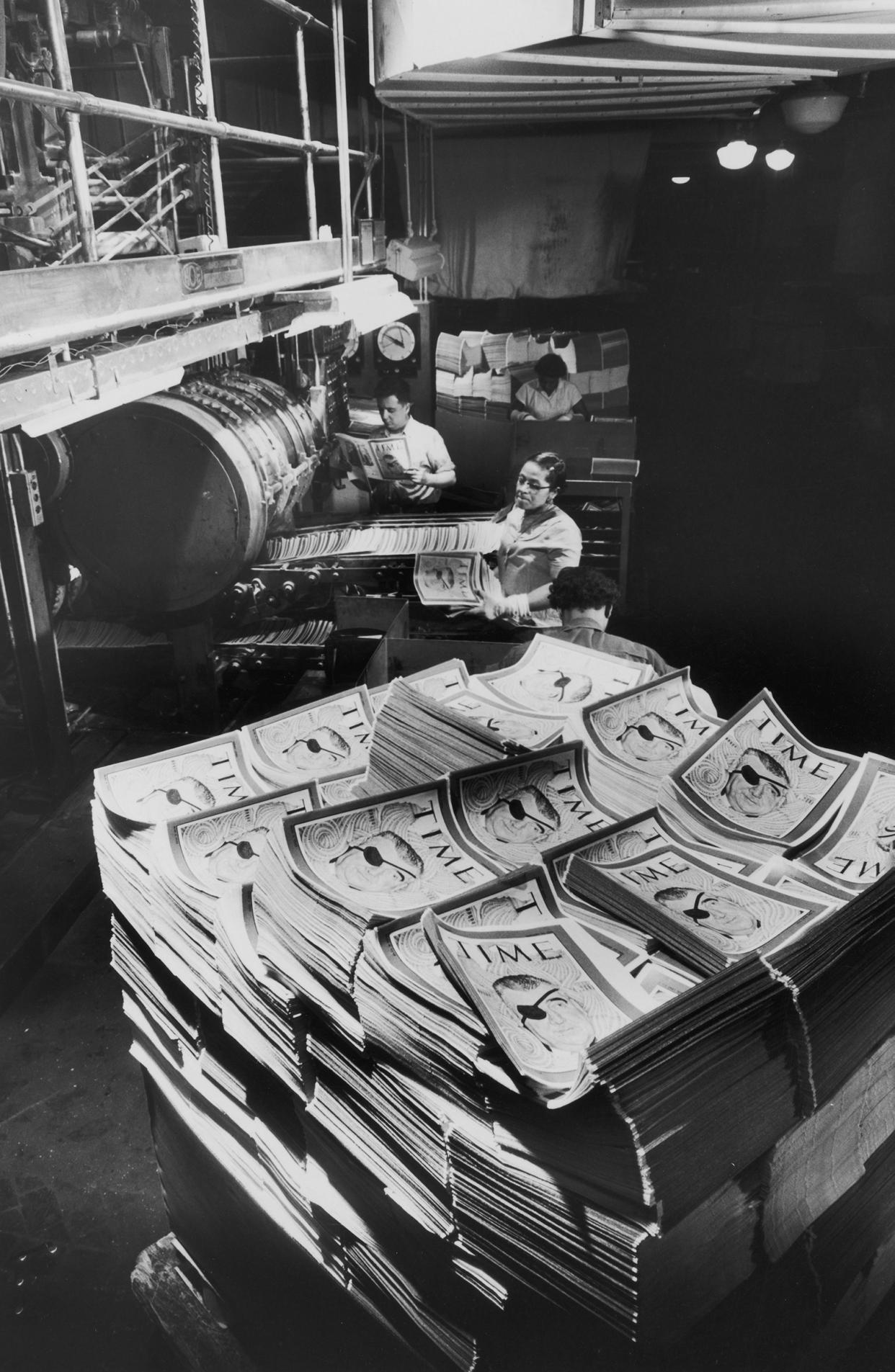 Issues of TIME are stacked at the R.R. Donnelley & Sons Company printing press in Crawfordsville, Ind., 1956.