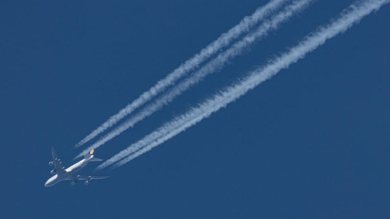 A Boeing 747 creating contrails.