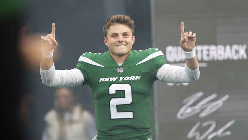 New York Jets quarterback Zach Wilson gestures as he is introduced before an NFL football game against the Philadelphia Eagles, Sunday, Oct. 15, 2023, in East Rutherford, N.J.