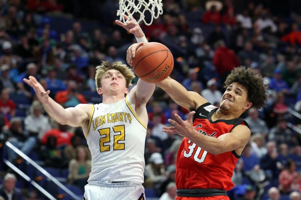 Lyon County’s Brady Shoulders (22) and George Rogers Clark’s Tyleik Maxwell (30) fight for a rebound on Friday night.