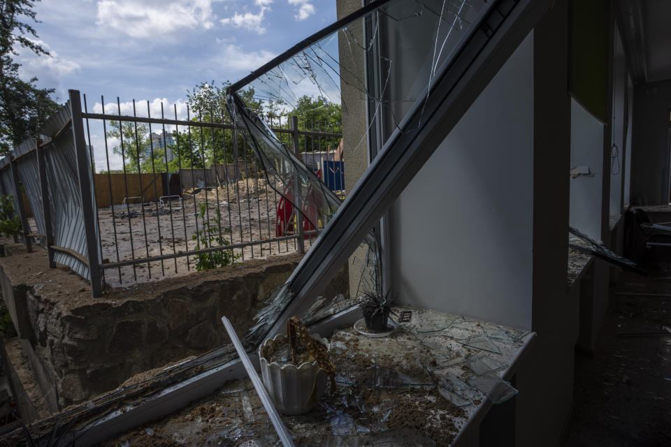 Damages seen in the classroom of a kindergarten in the aftermath of Russian missile strikes fired toward Kyiv early Sunday, where a crater pocked the courtyard, in Kyiv, Ukraine, Monday, June 27, 2022. (AP Photo/Nariman El-Mofty)