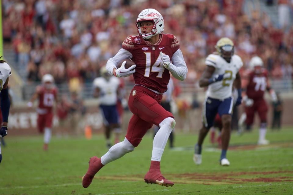 Redshirt wide receiver Johnny Wilson (14) rushes toward the end zone. Florida State football defeated Georgia Tech, 41-16, On Oct. 29, 2022, at Doak Campbell Stadium.