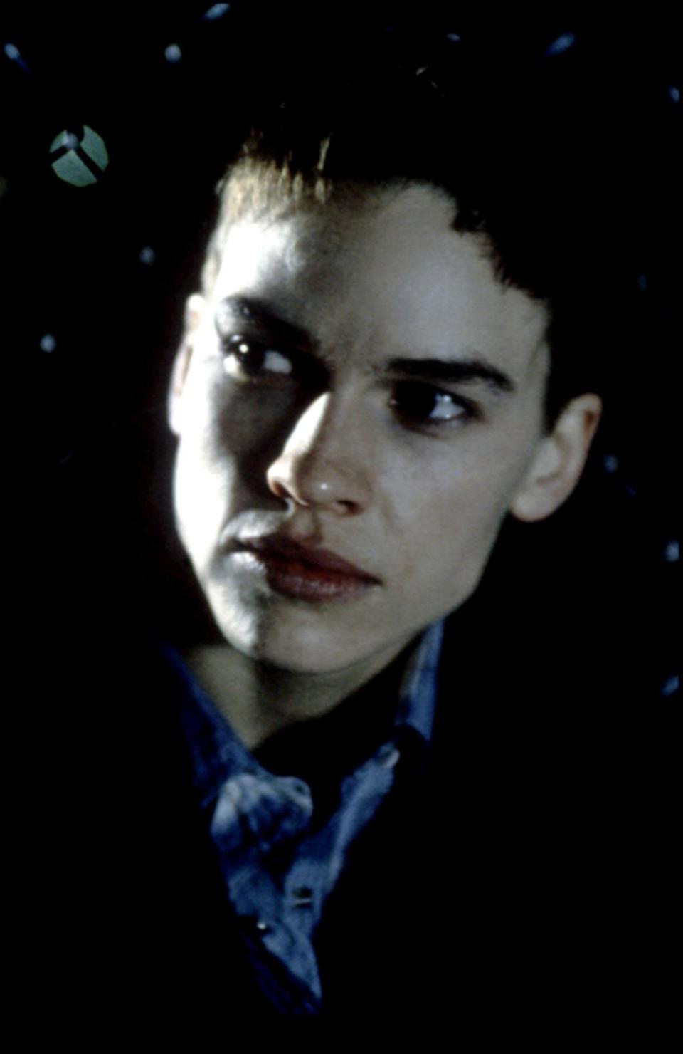 Hilary Swank portrays the true story of a transgendered female to male, Brandon Teena, in “Boys Don’t Cry.” Her short haircut helps her powerful performance for which she won the Academy Award for Best Actress.