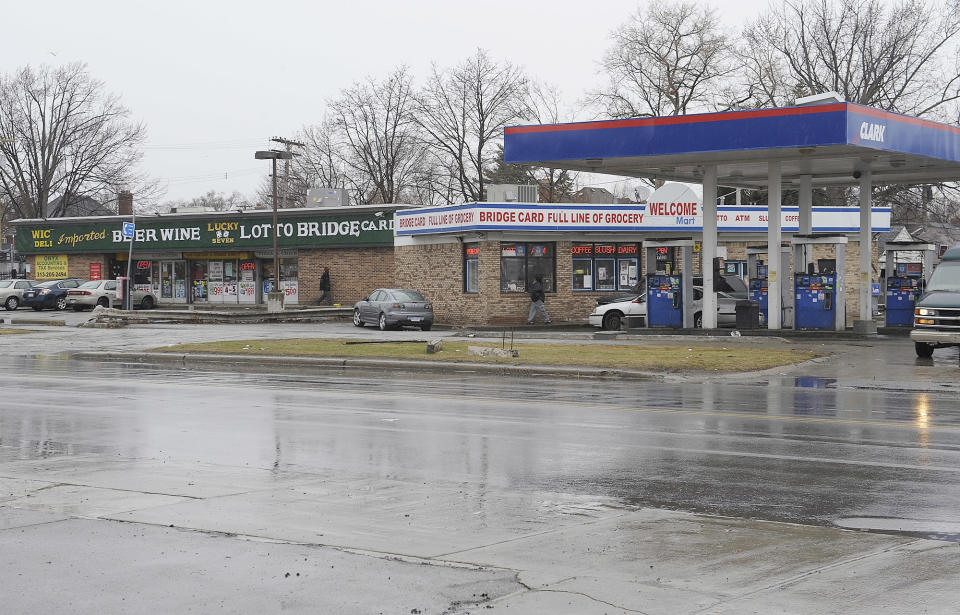 Cars enter local business at the scene of an attack on Wednesday at the street corners of Morang and Balfour on Thursday, April 3, 2014 in Detroit. A suburban Detroit man was in critical condition Thursday with severe head injuries after a neighborhood mob beat and kicked him when he stopped to check on a 10-year-old boy who stepped from a curb into the path of his pickup. The 54-year-old man, whose name was not released, was being treated at a Detroit hospital as police scoured the east side neighborhood where he was attacked Wednesday afternoon. The boy, David Harris, was expected to recover from his injuries, according to Desmond Key, who said he was the 10-year-old's uncle. (AP Photo/Detroit News, Clarence Tabb Jr) DETROIT FREE PRESS OUT; HUFFINGTON POST OUT