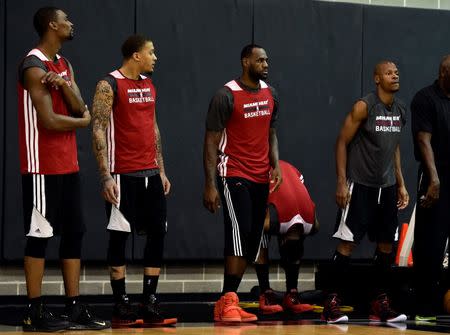 (left to right) Miami Heat center Chris Bosh (1) forward Michael Beasley (8) forward LeBron James (6) and guard Ray Allen (34) during practice before game 2 of the 2014 NBA Finals at Spurs Practice Facility. Mandatory Credit: Bob Donnan-USA TODAY Sports