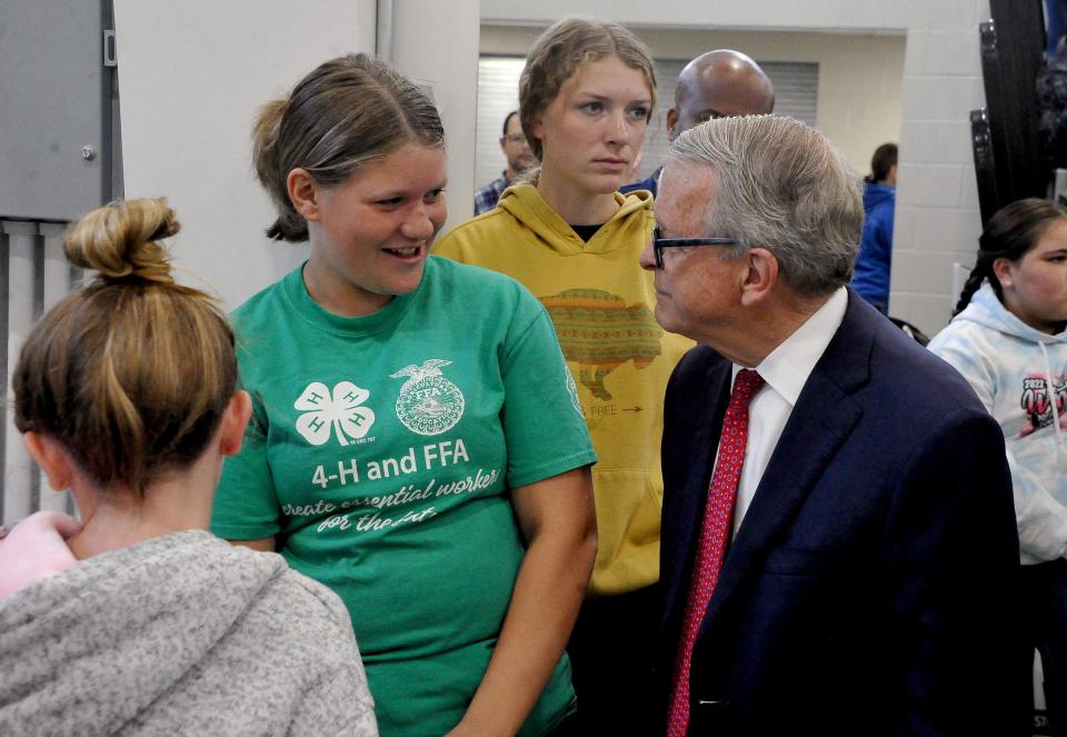 Gov. Mike DeWine talks with 4-H student Mia Snyder at the Wayne County Fair.