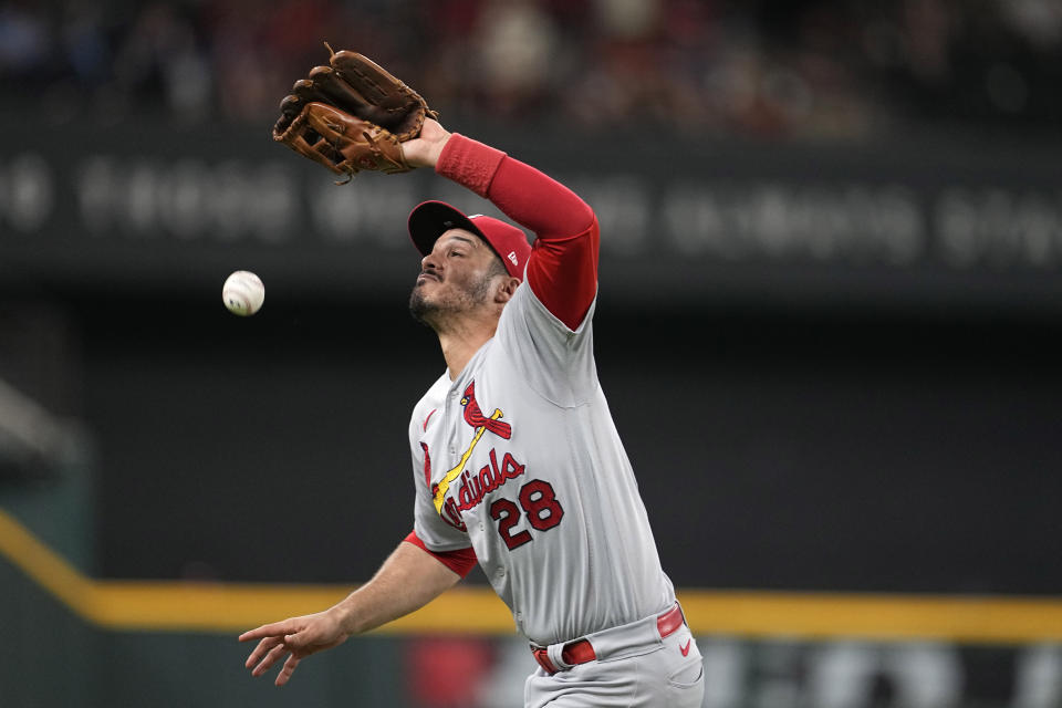 St. Louis Cardinals third baseman Nolan Arenado is unable to reach a single by Texas Rangers' Corey Seager in the ninth inning of a baseball game, Monday, June 5, 2023, in Arlington, Texas. (AP Photo/Tony Gutierrez)