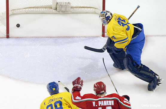 Edmonton Oilers goalie Ty Conklin misses the shot for the third