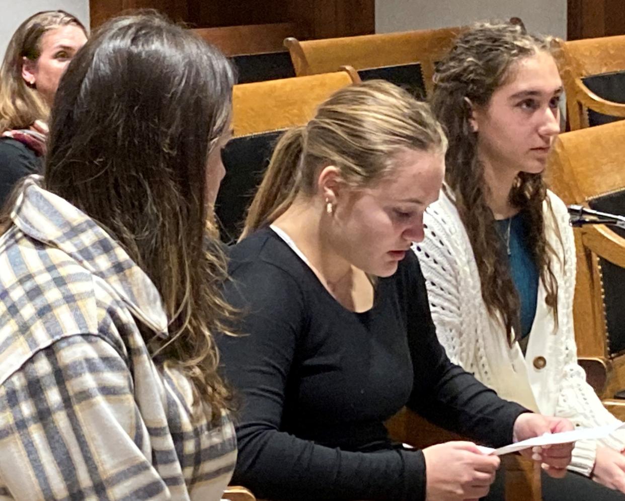Teenagers from Norwood, from left, Delilah Sayers,17, Addie Cataldo, 16, and Haido Bratsis, 17, testify before the Joint Committee on State Administration and Regulatory Oversight in support of an official ice cream flavor for Massachusetts: Cookies and cream.