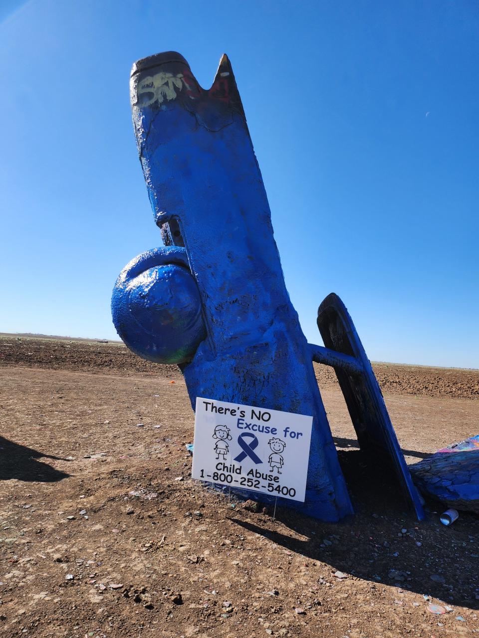 Cadillac Ranch goes blue as the Texas Department of Family Protective Services in collaboration with Saint Francis Ministries paint the local monument in honor of National Child Abuse Prevention month.