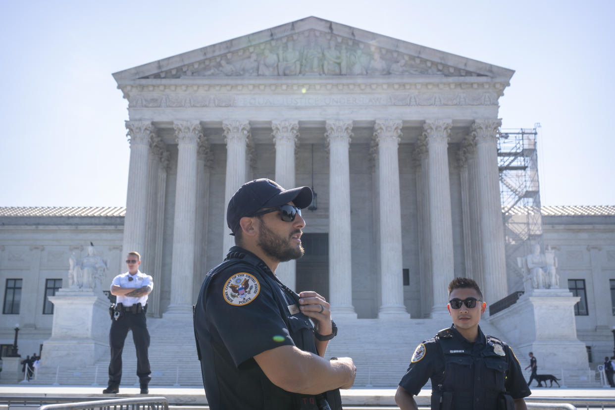 Supreme Court Police officers outside of the building.
