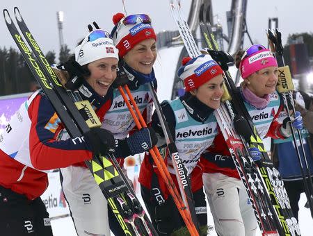 FIS Nordic Ski World Championships - Women's Cross-Country 4 x 5 km Relay - Lahti, Finland - 2/3/17 - Team Norway's Marit Bjoergen, Maiken Caspersen Falla, Heidi Weng pose after the race. REUTERS/Kai Pfaffenbach