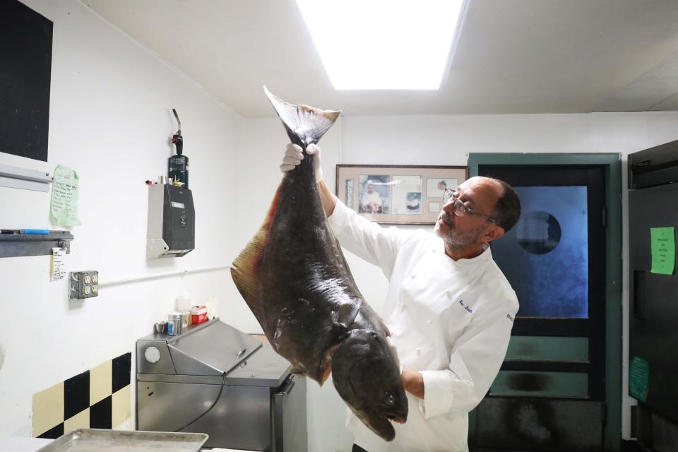 Tsunami chef and owner, Ben Smith, celebrates their 25 years of business. Tsunami is located at 928 Cooper Street in Memphis, Tenn. Ben is holding a giant Halibut fish that he is going to prepare on June 29, 2023.