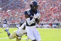 Mississippi wide receiver Malik Heath (8) catches a touchdown pass past Tulsa cornerback Tyree Carlisle (4) during the first half of an NCAA college football game in Oxford, Miss., Saturday, Sept. 24, 2022. (AP Photo/Thomas Graning)