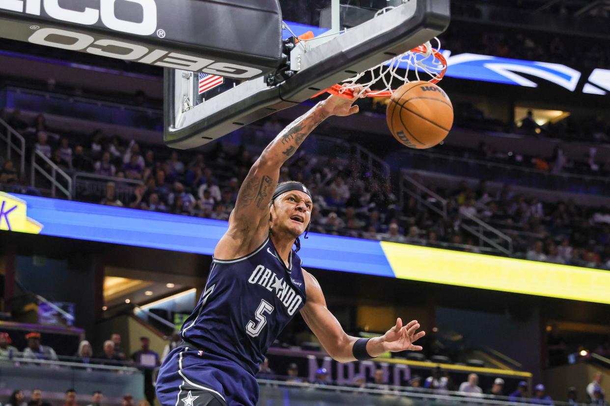 March 21: Orlando Magic forward Paolo Banchero dunks during the second quarter against the New Orleans Pelicans.