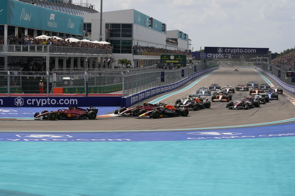 Ferrari driver Charles Leclerc of Monaco leads the field at the start of the Formula One Miami Grand Prix auto race at the Miami International Autodrome, Sunday, May 8, 2022, in Miami Gardens, Fla. (AP Photo/Darron Cummings)