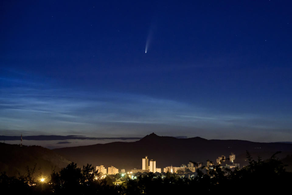 The Comet NEOWISE or C/2020 F3 is seen above Salgotarjan, Hungary, early Friday, July 10, 2020.  / Credit: Peter Komka / AP