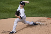 New York Yankees starting pitcher Clarke Schmidt winds up during the third inning of a baseball game against the Miami Marlins, Sunday, Sept. 27, 2020, at Yankee Stadium in New York. (AP Photo/Kathy Willens)