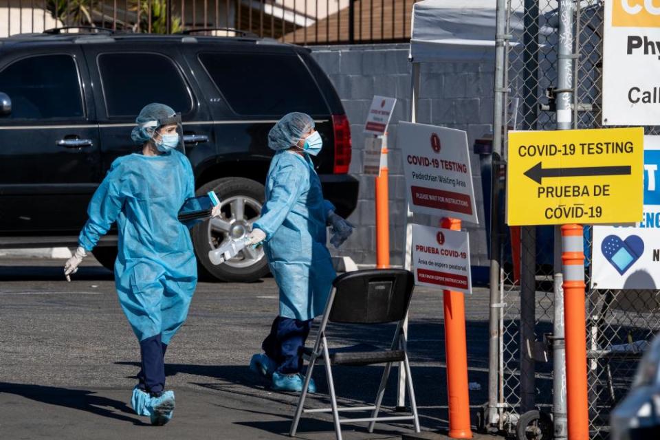 Health workers are seen at the Florence medical clinic, where coronavirus tests are administered.