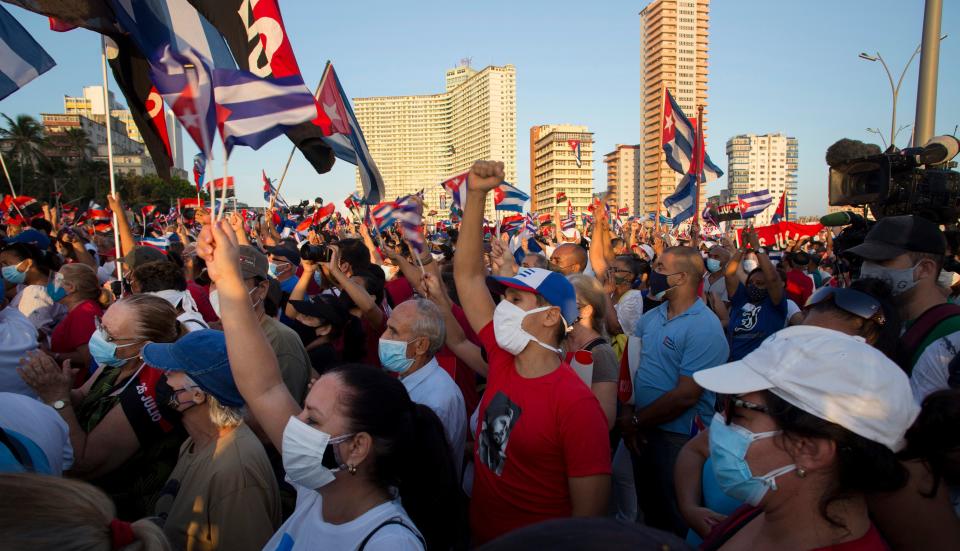 People attend a cultural-political event on the seaside Malecon Avenue with thousands of people in a show of support for the Cuban revolution six days after the uprising of anti-government protesters across the island, in Havana, Cuba, Saturday, July 17, 2021.