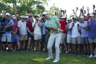 Rory McIlroy, of Northern Ireland, hits from the rough in the gallery on the 16th green during the final round of the Tour Championship golf tournament at East Lake Golf Club, Sunday, Aug. 28, 2022, in Atlanta. (AP Photo/John Bazemore)