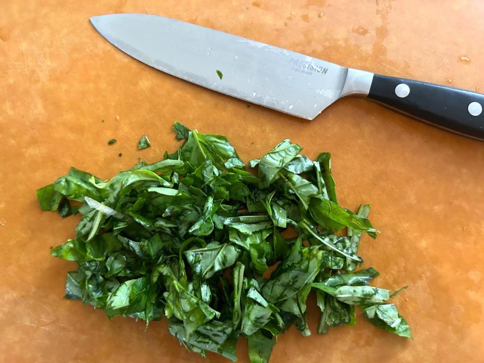 Chopping the basil for Ina Garten's weeknight pasta
