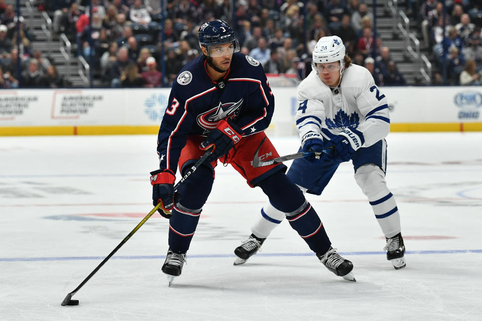 COLUMBUS, OH - OCTOBER 4: Seth Jones #3 of the Columbus Blue Jackets shields the puck from Kasperi Kapanen #24 of the Toronto Maple Leafs during the third period in a game on October 4, 2019 at Nationwide Arena in Columbus, Ohio.  (Photo by Jamie Sabau/NHLI via Getty Images)