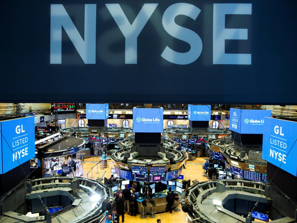 FILE PHOTO: Traders work on the floor at the New York Stock Exchange (NYSE) in New York, U.S., August 12, 2019. REUTERS/Eduardo Munoz/File Photo