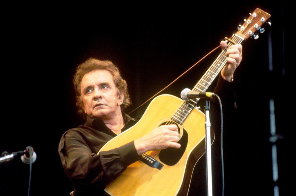 Johnny Cash performs on stage at Glastonbury Festival