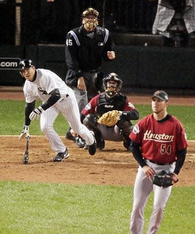 Houston Astros closer Brad Lidge (54) watches as Chicago White sox Scott Podsednik breaks from the box after hitting a game-winning walkoff home run in the bottom of the ninth inning to give the White Sox a 7-6 win in Game 2 of the World Series Sunday, Oct. 23, 2005, in Chicago